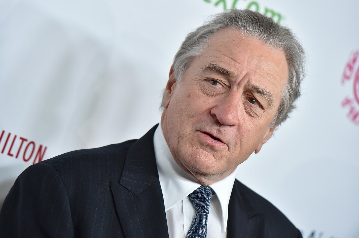 Robert De Niro posing in a suit at the 2018 Carousel of Hope Ball at The Beverly Hilton Hotel.