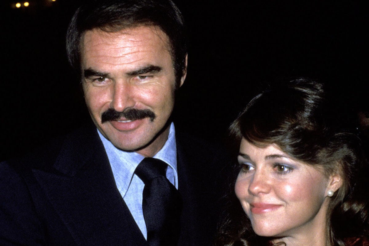 Sally Field, who Oprah Winfrey asked about Burt Reynolds' toupee, stands with Reynolds