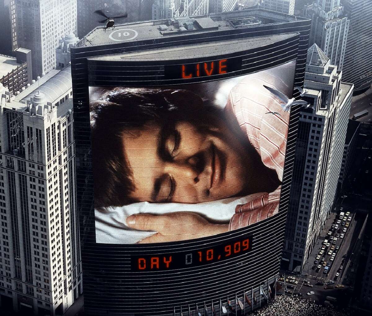 Jim Carrey as Truman Burbank sleeps on the movie poster for 'The Truman Show'