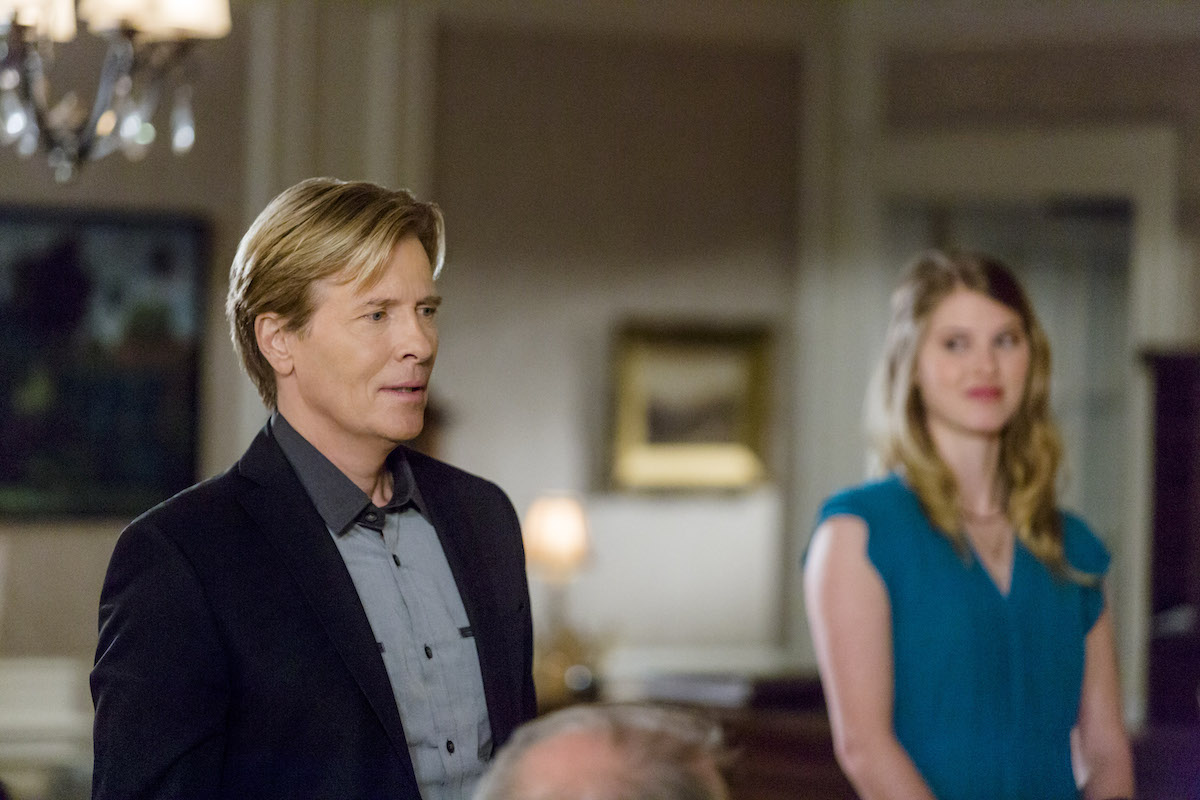 Jack Wagner looking concerned and standing next to a blonde woman in 'The Wedding March'
