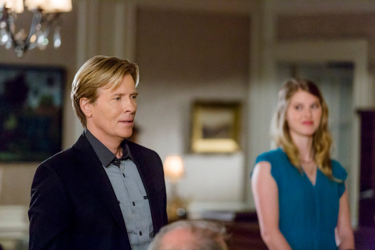 Jack Wagner looking concerned and standing next to a blonde woman in 'The Wedding March'