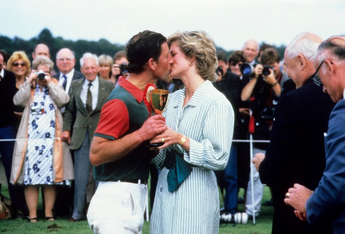 Then-Prince Charles and Princess Diana kissing after a polo charity match