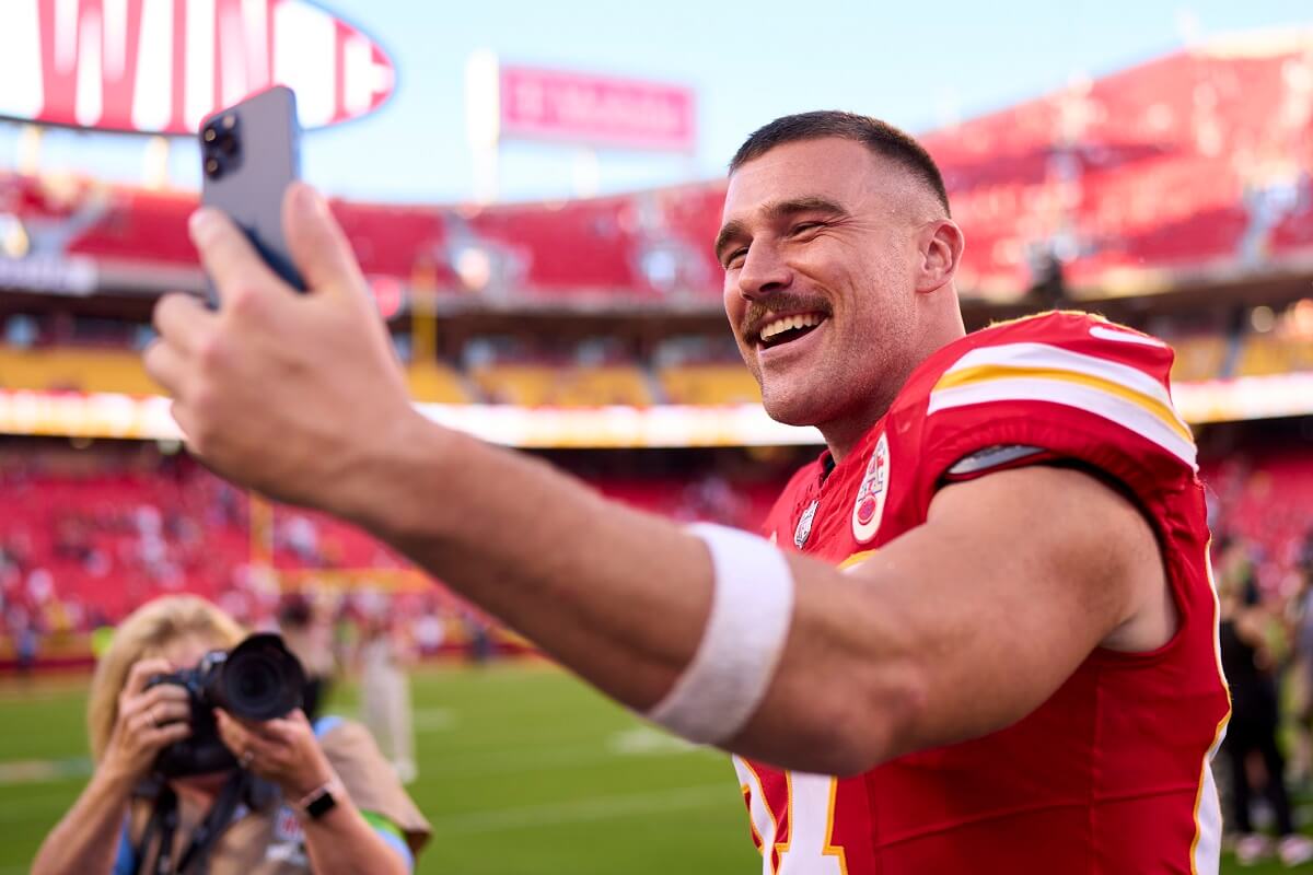 Travis Kelce, who once dated 50 women at one time on his reality show 'Catching Kelce,' celebrates after win at GEHA Field at Arrowhead Stadium