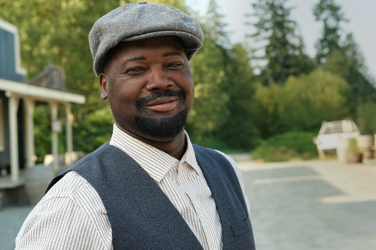 Smiling Joseph wearing a hat in 'When Calls the Heart' Season 10