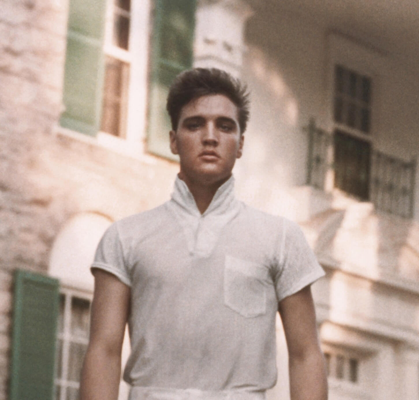 "In the Ghetto" singer Elvis Presley wearing a polo shirt