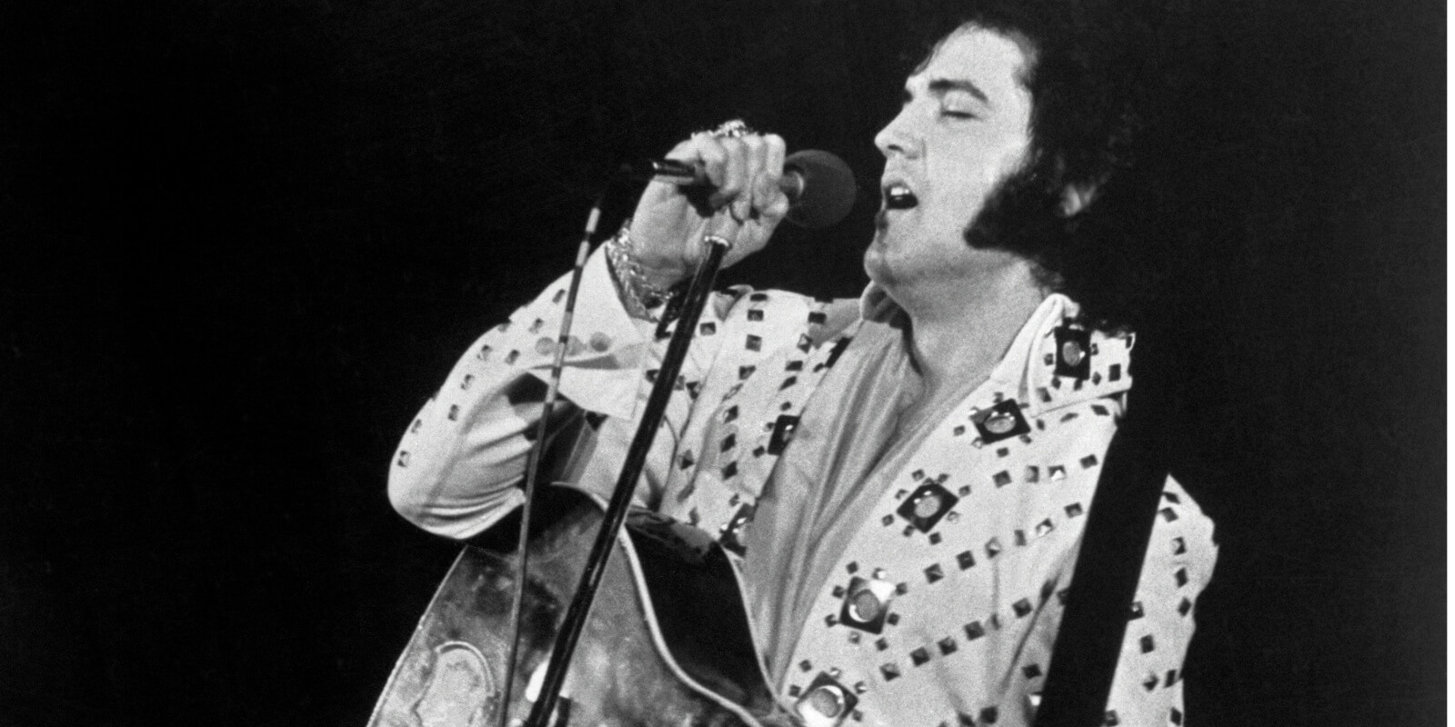Elvis Presley performs on stage in the early 1970s.