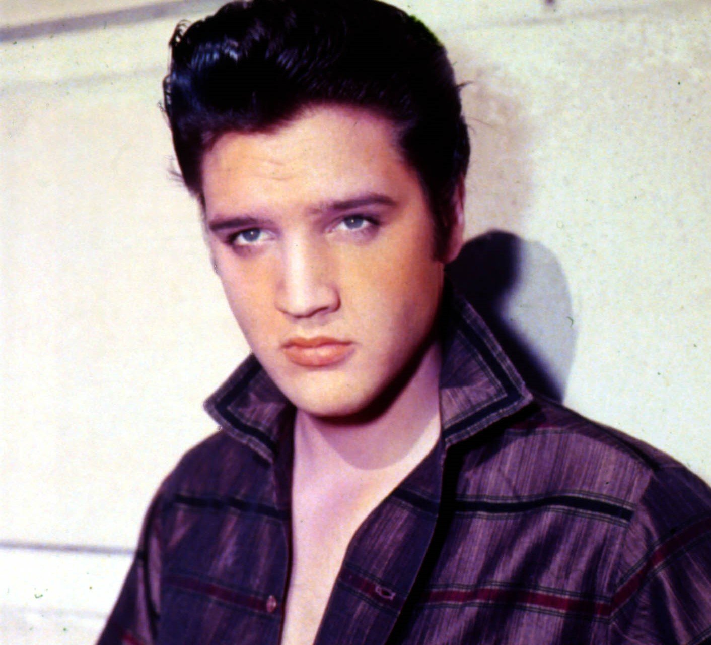 Elvis Presley wearing purple