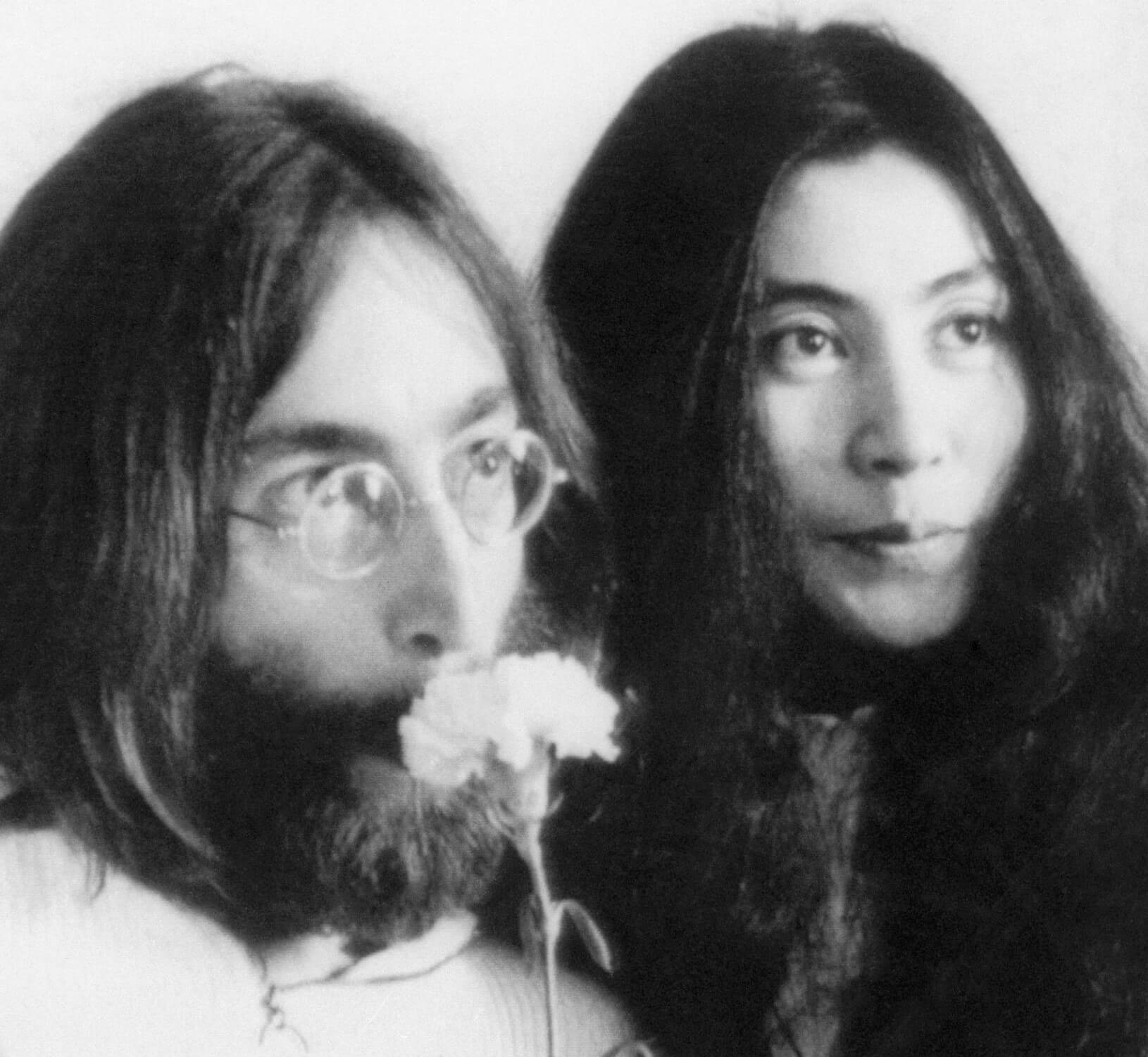 John Lennon and Yoko Ono in black-and-white during the "Give Peace a Chance" era