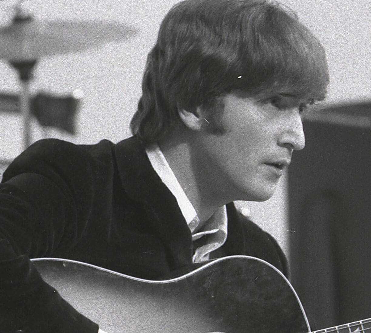 John Lennon wearing a suit
