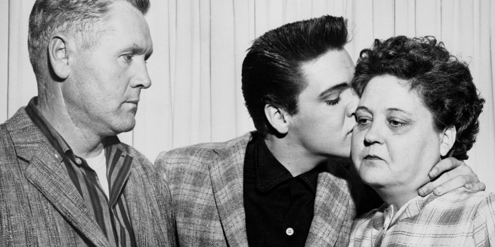 Vernon, Elvis, and Gladys Presley photographed together on the eve of his US Army induction.