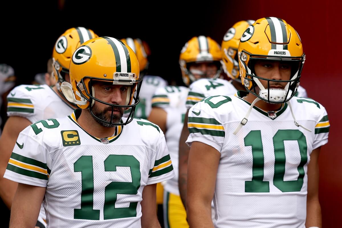 Aaron Rodgers and Jordan Love take the field for warmups before game against the Washington Commanders