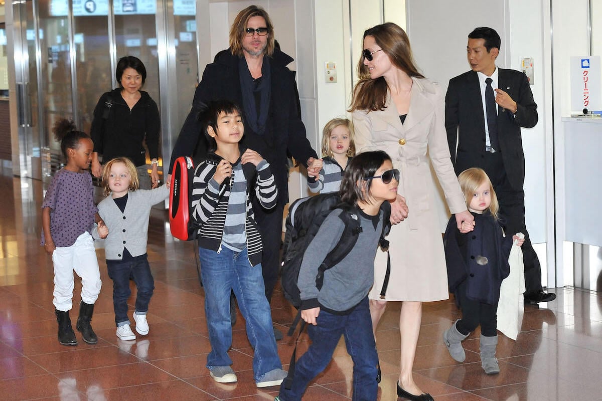 Brad Pitt and Angelina Jolie with their children at a Tokyo airport