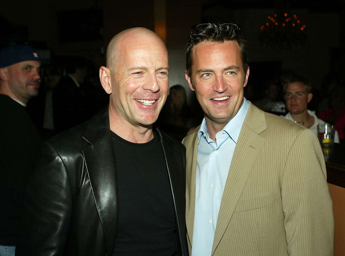 Bruce Willis and Matthew Perry talk at the after-party for the premiere of Warner Bros. "The Whole Ten Yards" at the Sunset Room on April 7, 2004