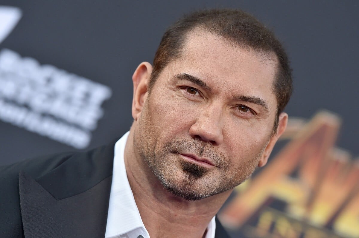 Dave Bautista posing in a suit at the premiere of 'Avengers: Infinity War'.
