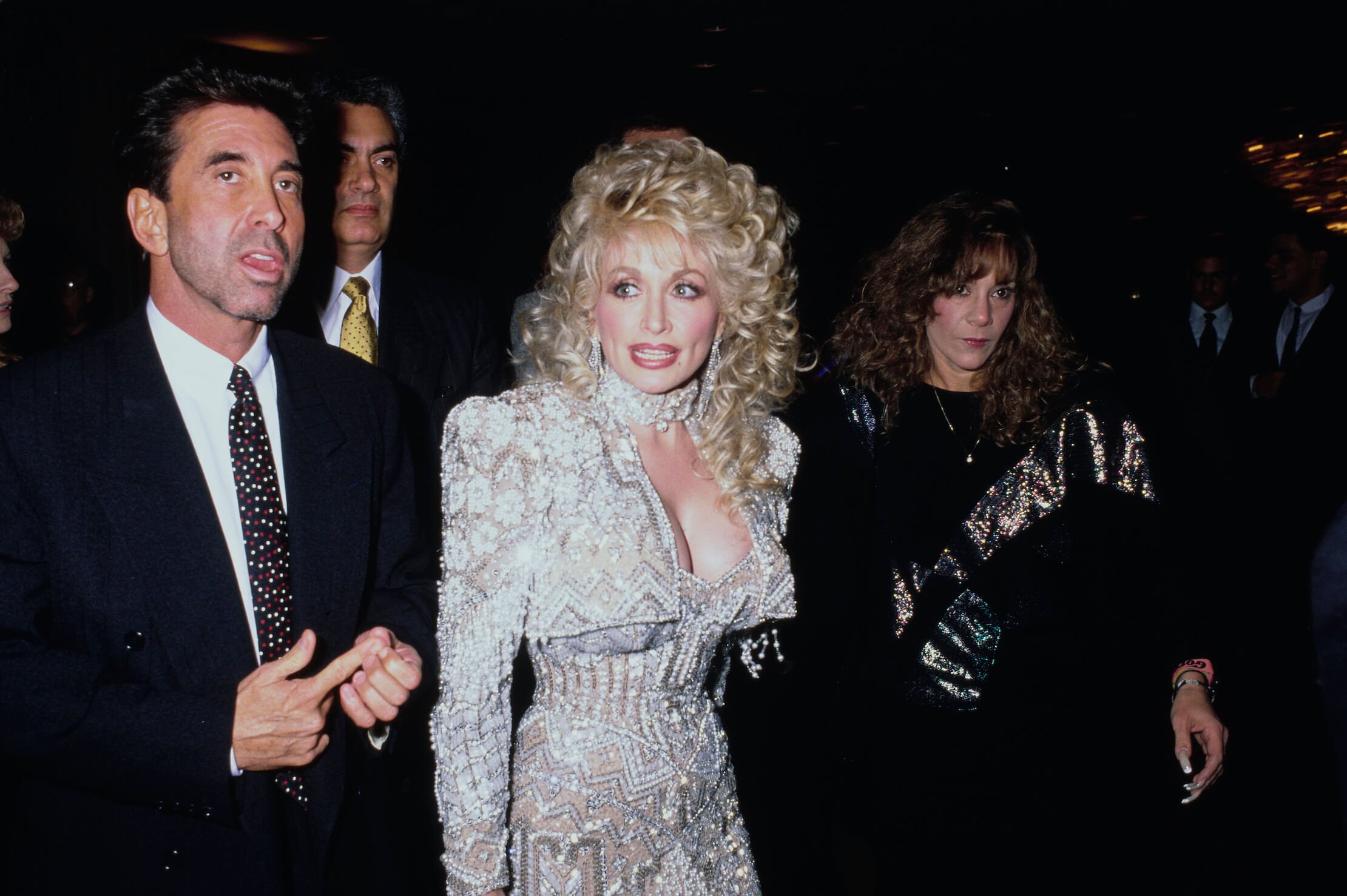 Dolly Parton wearing a sparkly gown at a red carpet event in the '90s