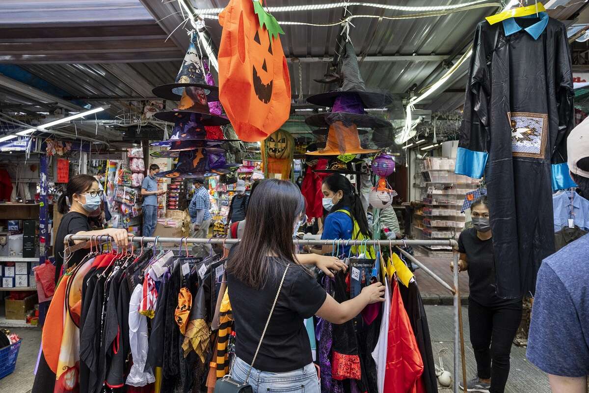 Shoppers browse through Halloween costumes in a Hong Kong store