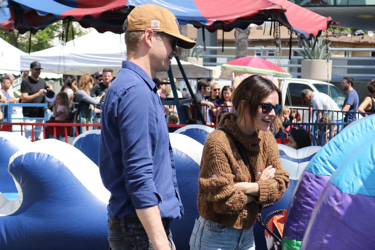 Hayden Christensen and Rachel Bilson, the parents of daughter Briar Rose Christensen, stand next to each other and look on