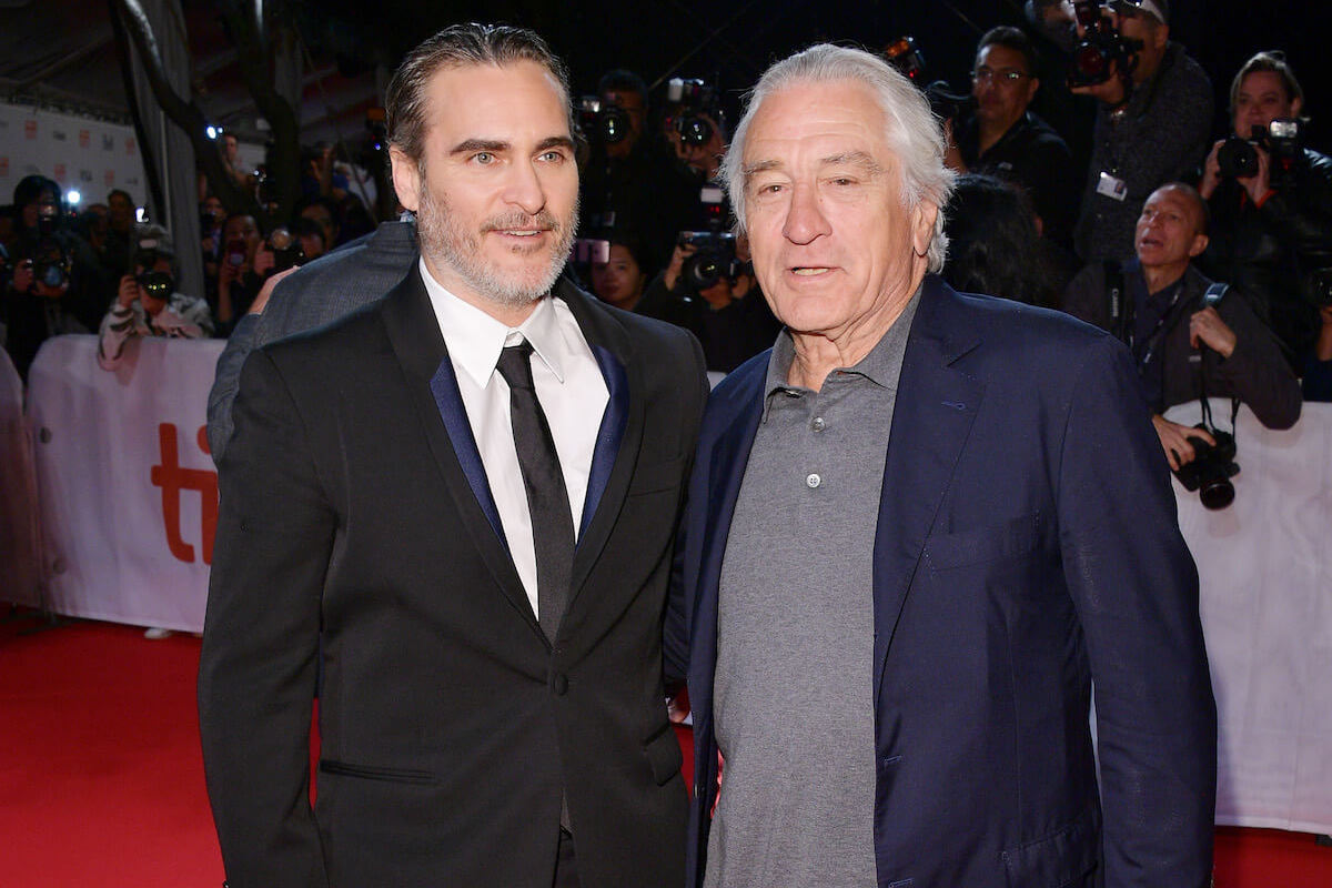 Joaquin Phoenix and Robert De Niro pose on the red carpet at the 'Joker' TIFF premiere