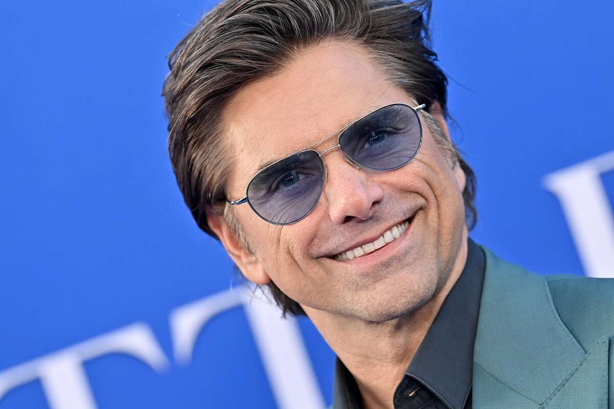 John Stamos wears sunglasses at the world premiere of 'The Little Mermaid' in May 2023