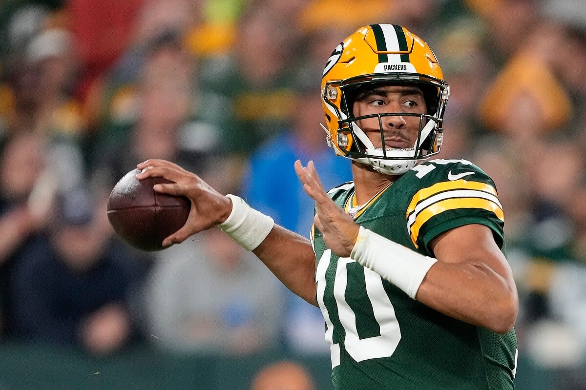 Jordan Love of the Green Bay Packers, who has fans curious about his age and net worth, looks to throw a pass against the Detroit Lions