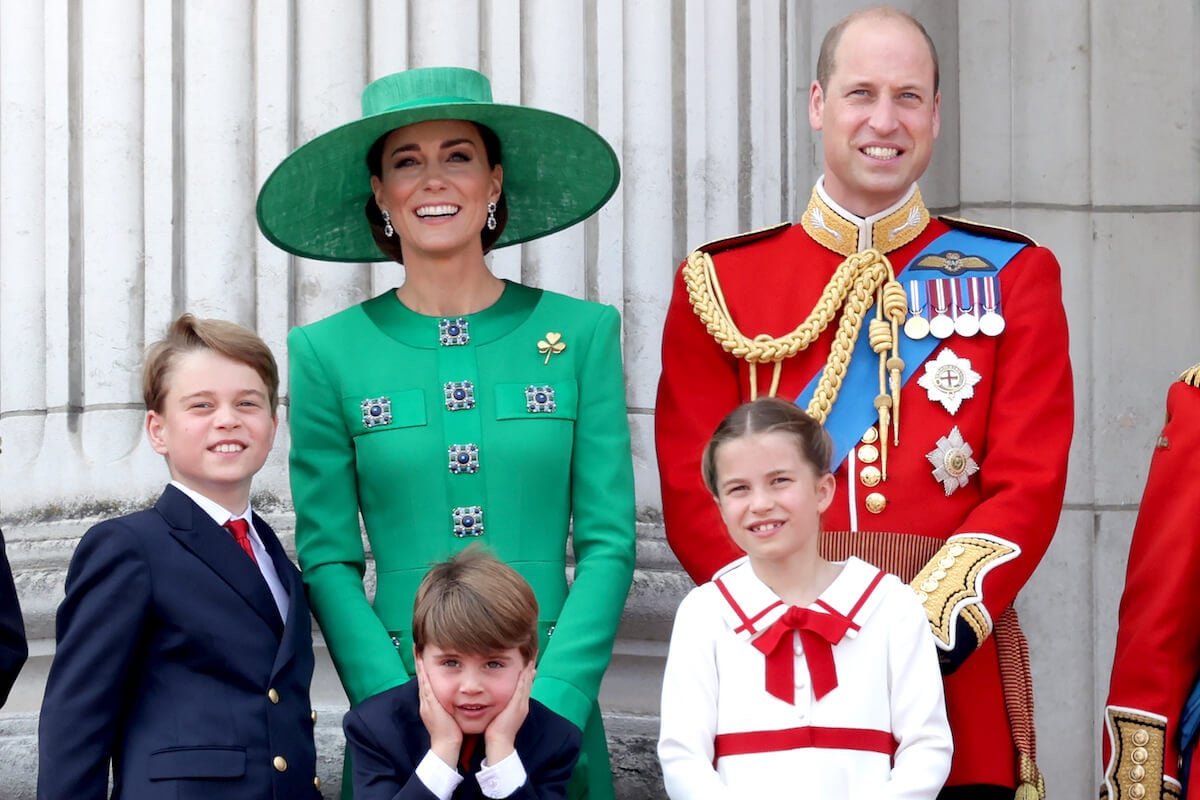 Kate Middleton and Prince William, who fear their children's 'exposure,' stand with Prince George, Prince Louis, and Princess Charlotte stand together on the Buckingham Palace balcony.