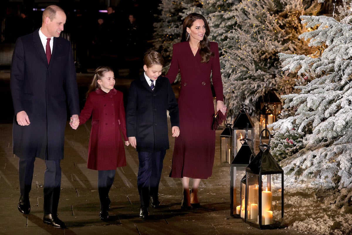 Kate Middleton, who hosts a Christmas carol concert at Westminster Abbey, walks with Prince William, Princess Charlotte, and Prince George