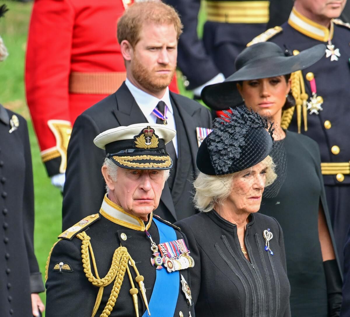King Charles, Queen Camilla, Prince Harry, and Meghan Markle following the state funeral of Queen Elizabeth II at Westminster Abbey