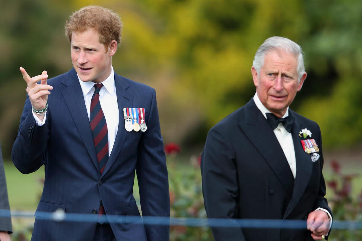 King Charles, who wants to 'hit the reset button,' stands with Prince Harry