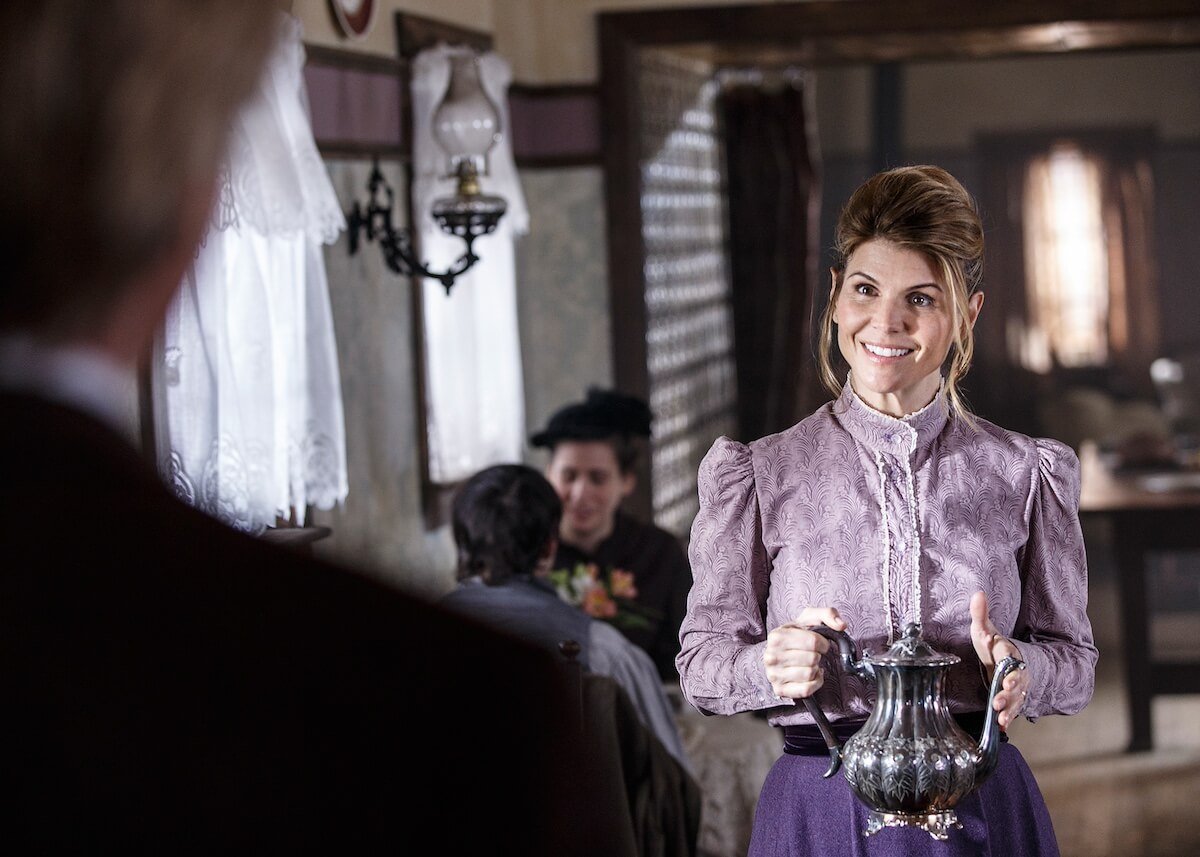 Lori Loughlin as Abigail holding a teapot in 'When Calls the Heart'
