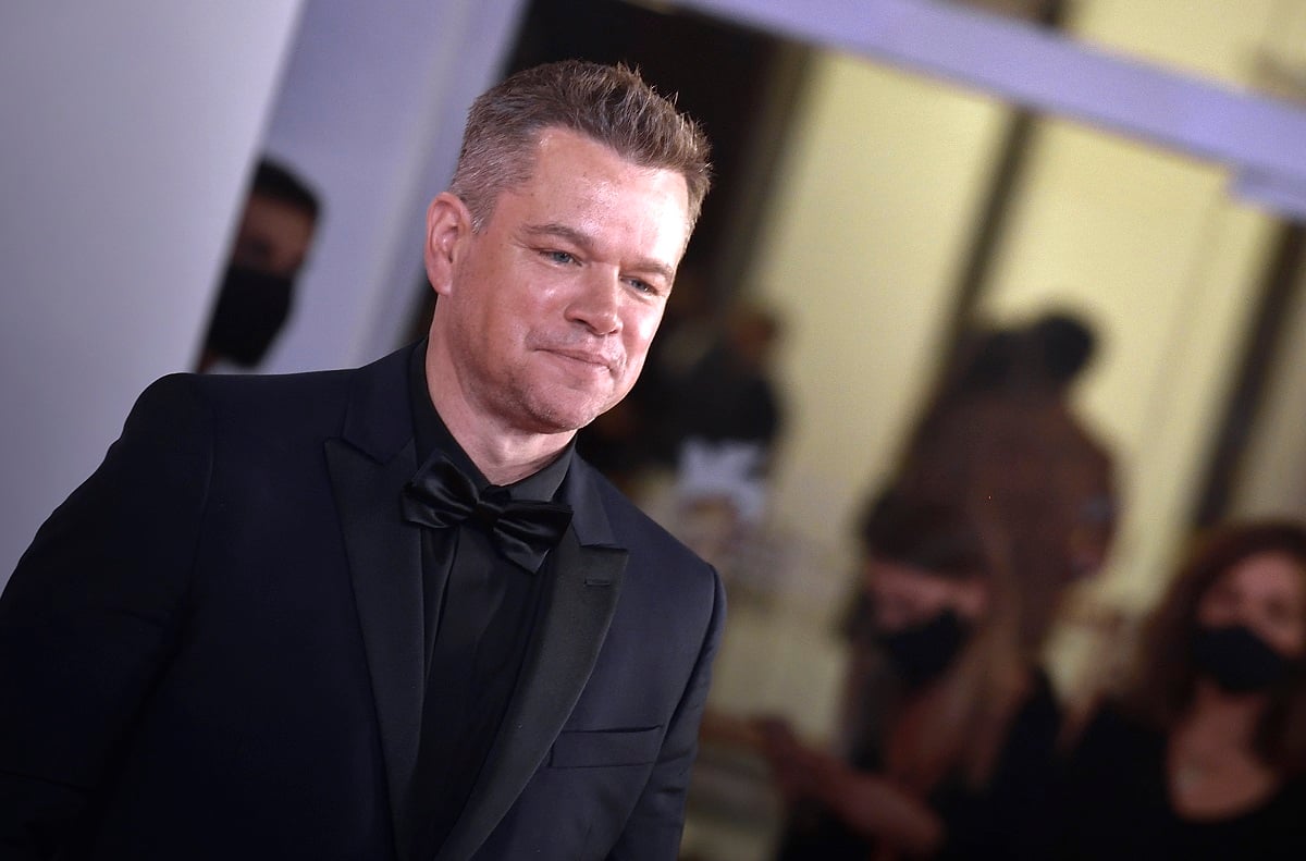 Matt Damon posing in a suit at the 78th Venice International Film Festival.