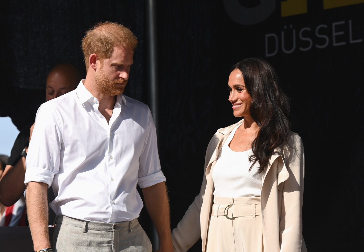 Meghan Markle and Prince Harry, who could move somewhere to cure the duke's U.K. homesickness, attend the swimming medal ceremony at Invictus Games Düsseldorf 2023