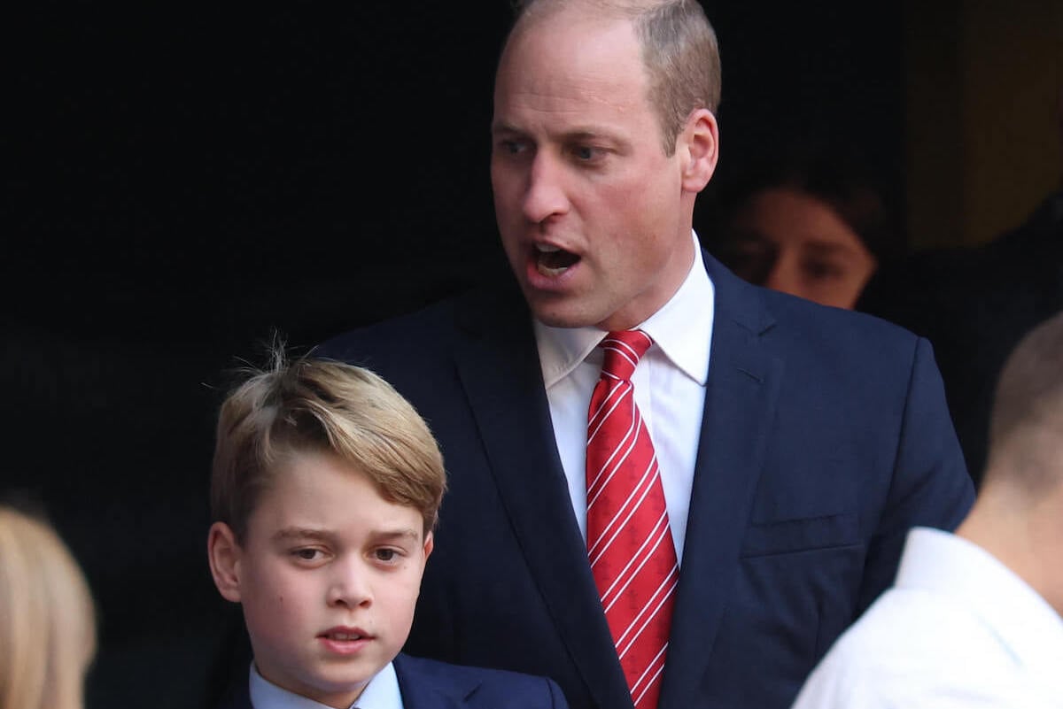 Prince George and Prince William, who sang Coldplay to baby Prince George, at a rugby match wearing suits and ties.