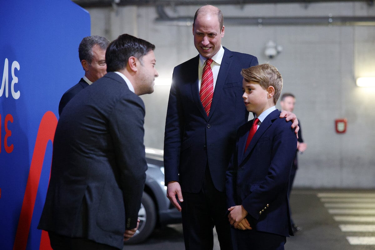 Prince George, whose attendance at boarding school would be 'sad, per an expert, stands with Prince William