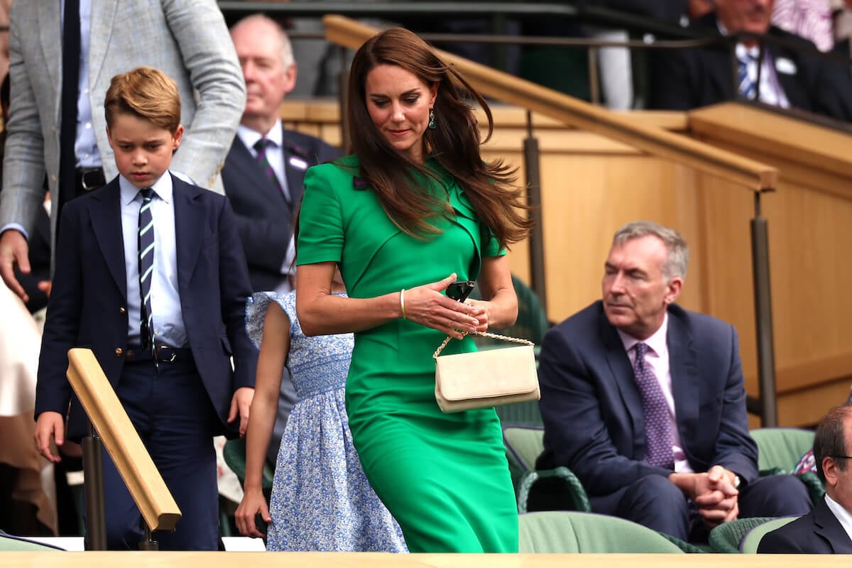 Prince George, whose school exams Kate Middleton decided to skip the 2023 Earthshot Prize Awards in Singapore for, walks with his mother and sister, Princess Charlotte