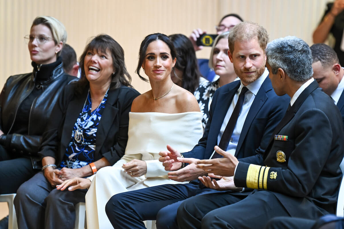 Prince Harry, whom John Kerry discussed at King Charles III's coronation, per Lady Glenconner, sits with Meghan Markle