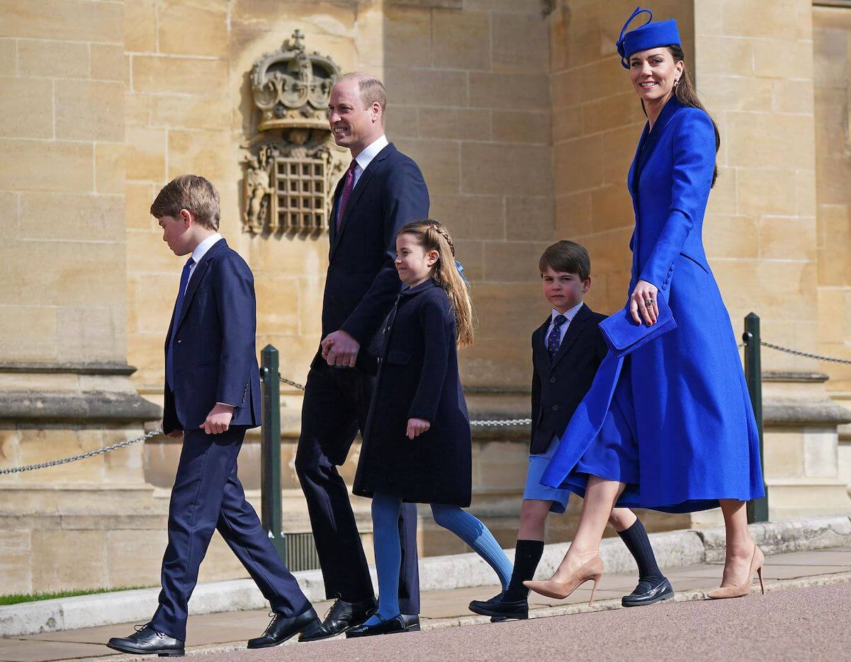 Prince William and Kate Middleton walking with their three kids