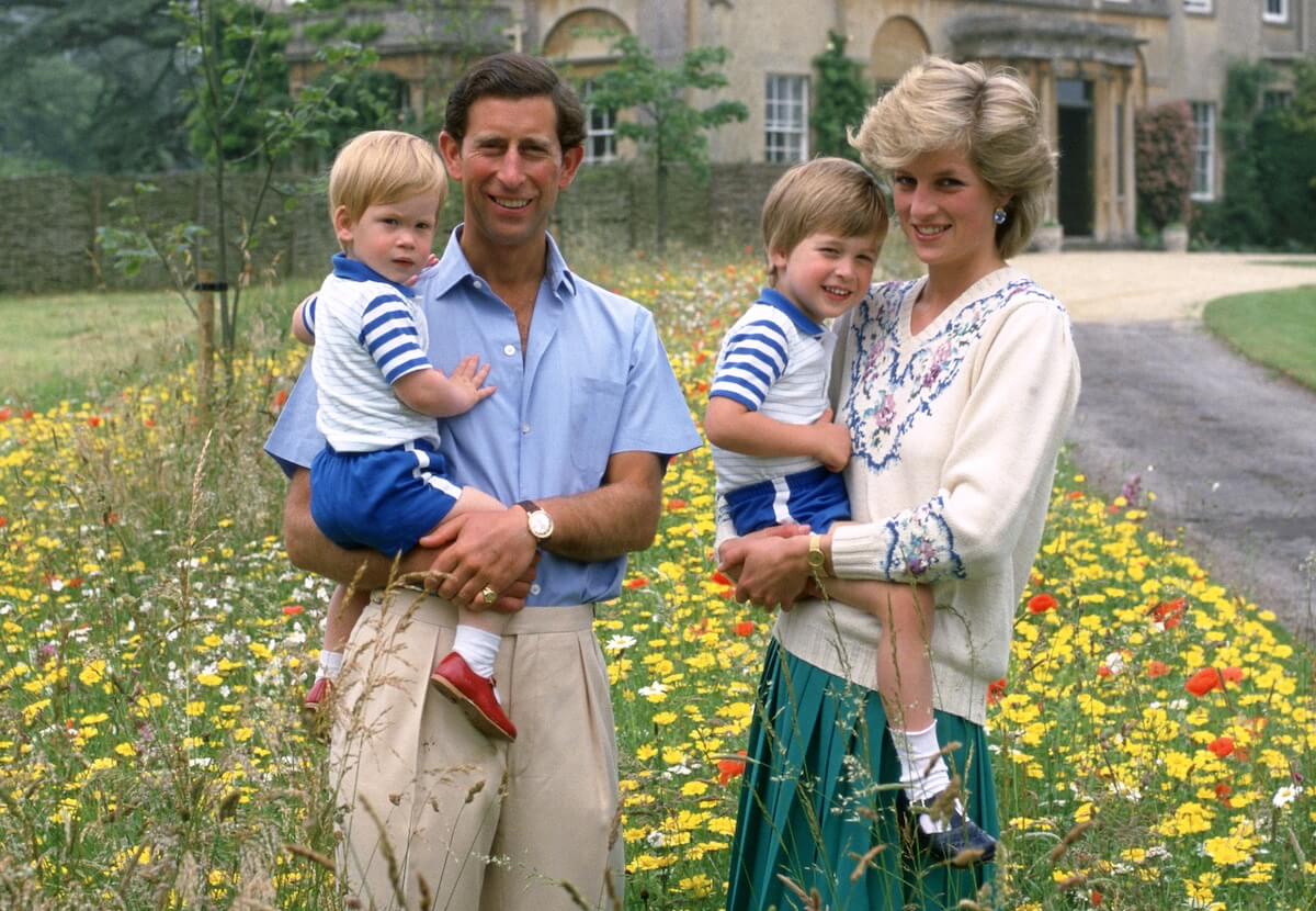 King Charles holds Prince Harry while Princess Diana holds Prince William in 1986