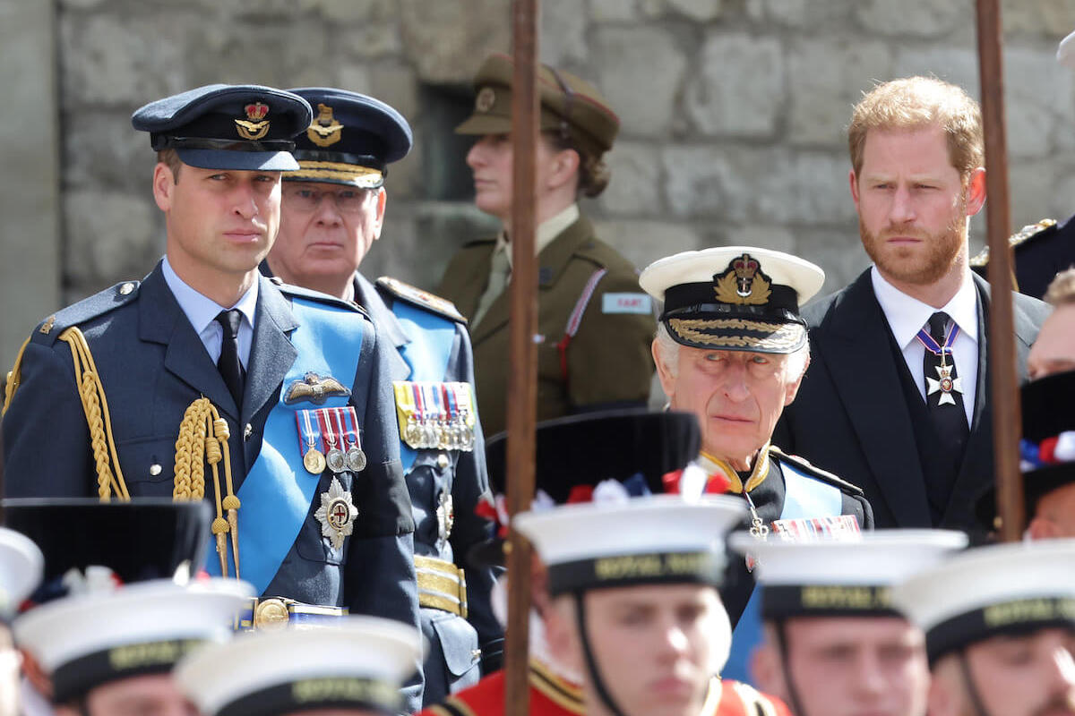 Prince William and Prince Harry, whose rift may not end until King Charles dies, stand behind their father
