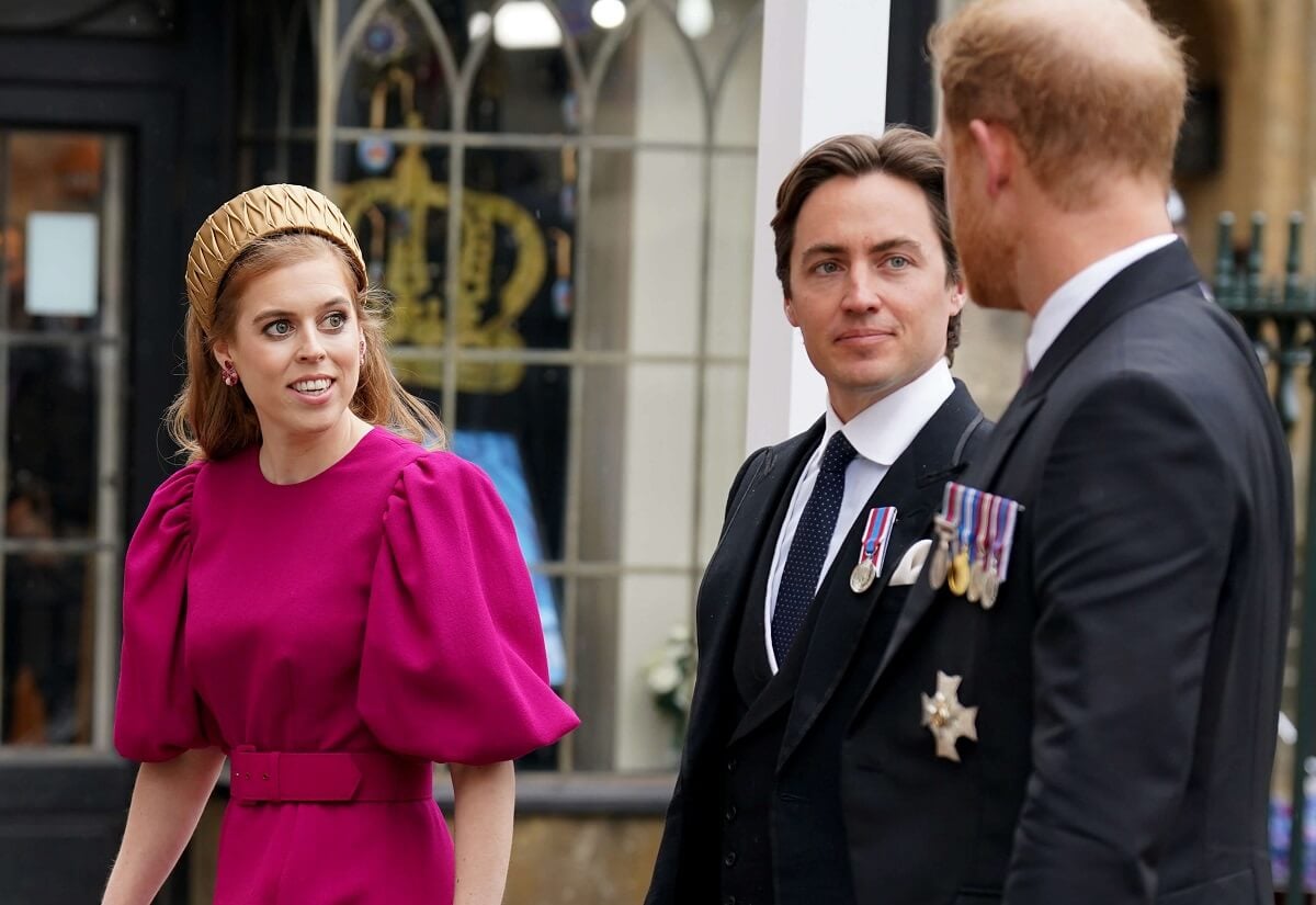 Princess Beatrice and her husband, Edoardo Mapelli Mozzi, talking with Prince Harry as they arrive at Westminster Abbey for King Charles' coronation