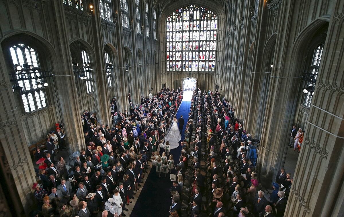 Princess Eugenie and Jack Brooksbank, who a body language expert said comforted each other before their royal wedding, walk back down the aisle at St George's Chapel, Windsor Castle