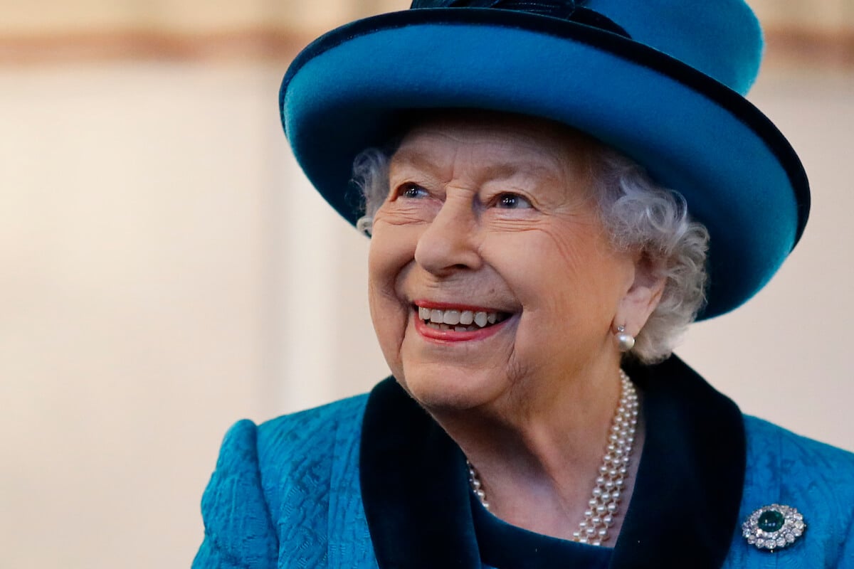 Queen Elizabeth II, who received a prank phone call, smiles