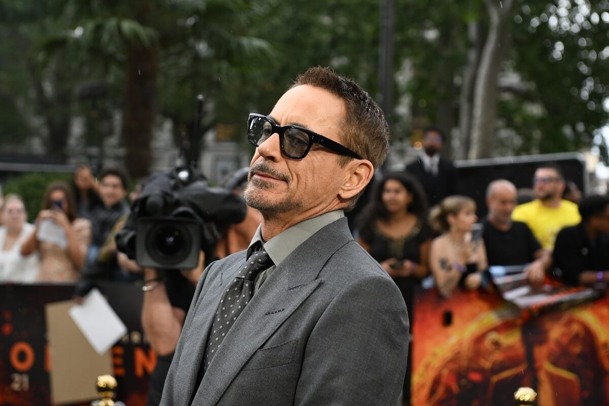 Robert Downey Jr. posing at the U.K. premiere of 'Oppenheimer' in a suit.