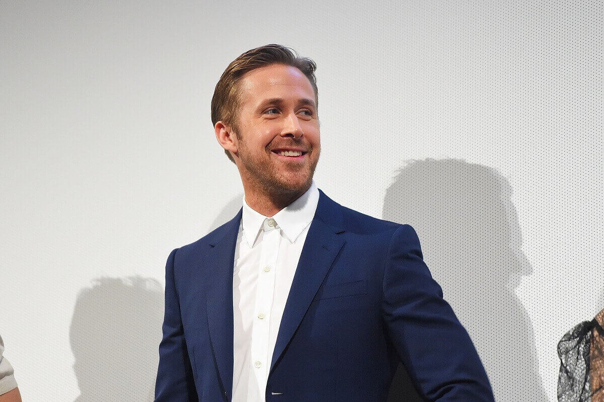 Ryan Gosling posing in a suit at the Song To Song" premiere.