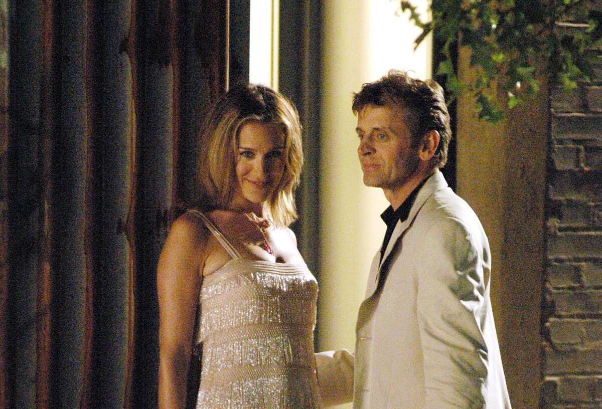 Sarah Jessica Parker as Carrie Bradshaw and Mikhail Baryshnikov asAleksandr Petrovsky in a scene for 'Sex and the City' season 6; Baryshnikov portrayed Carrie's season 6 love interest