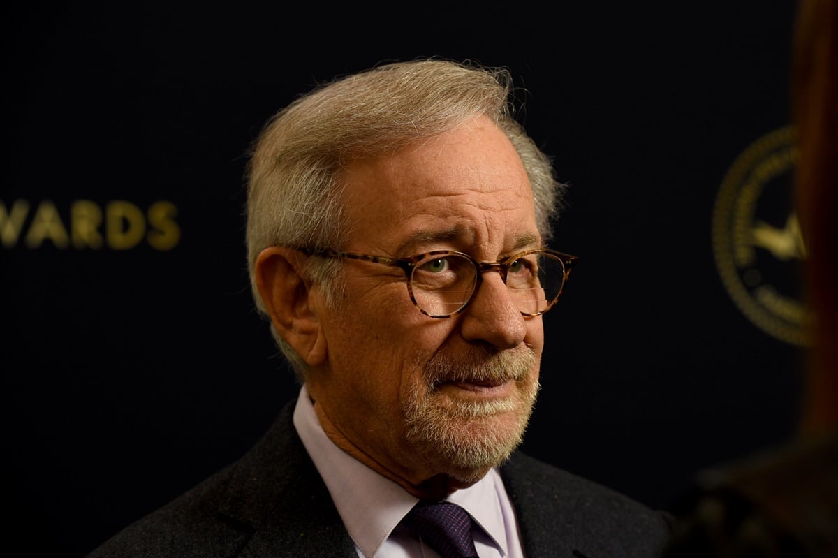 Steven Spielberg posing while wearing a suit at the AFI Awards.