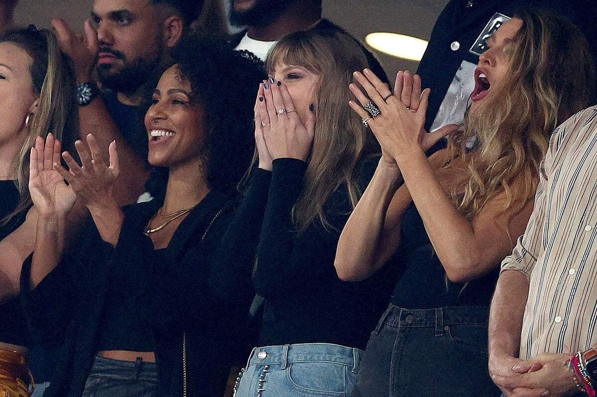 Taylor Swift, who a body language expert saw sending 'flirty' signals to Travis Kelce, cheering with Blake Lively at the game between the Kansas City Chiefs and the New York Jets at MetLife Stadium