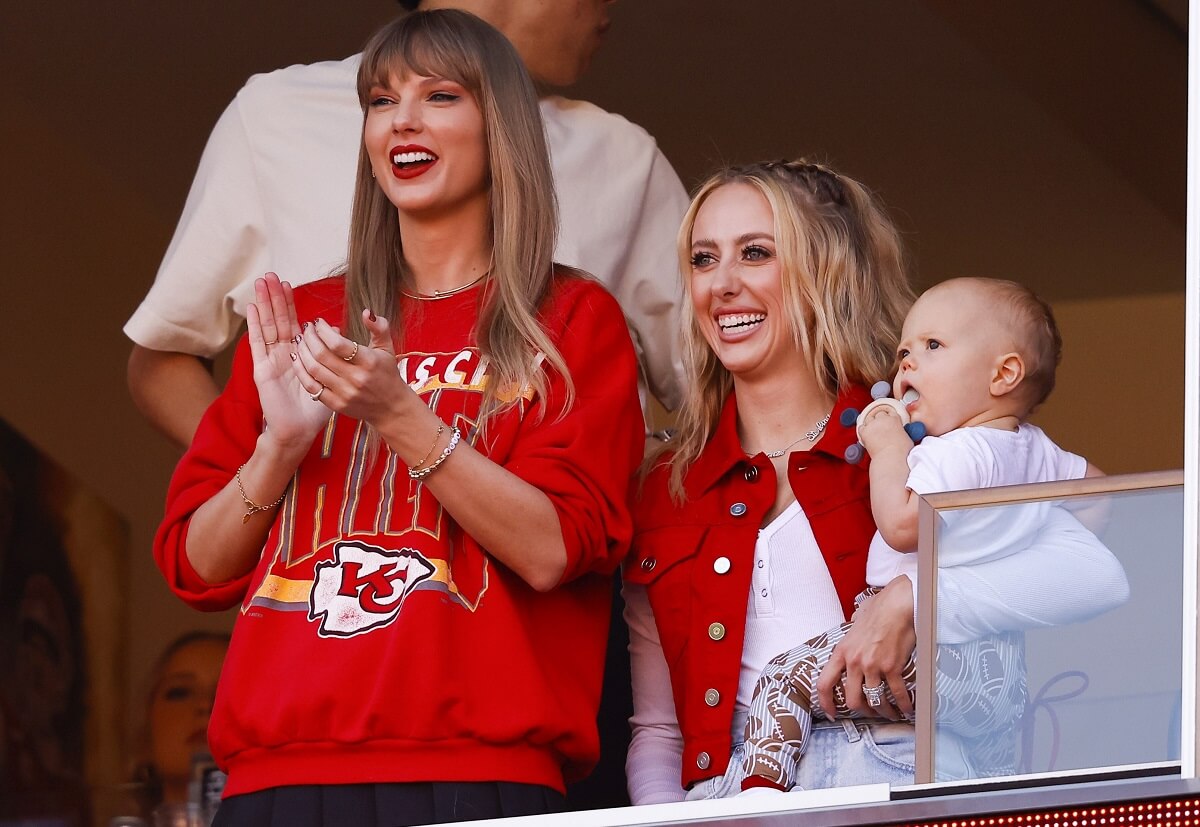 Taylor Swift, who has a higher net worth than Brittany Mahomes, look on from suite during a game with Mahomes' son