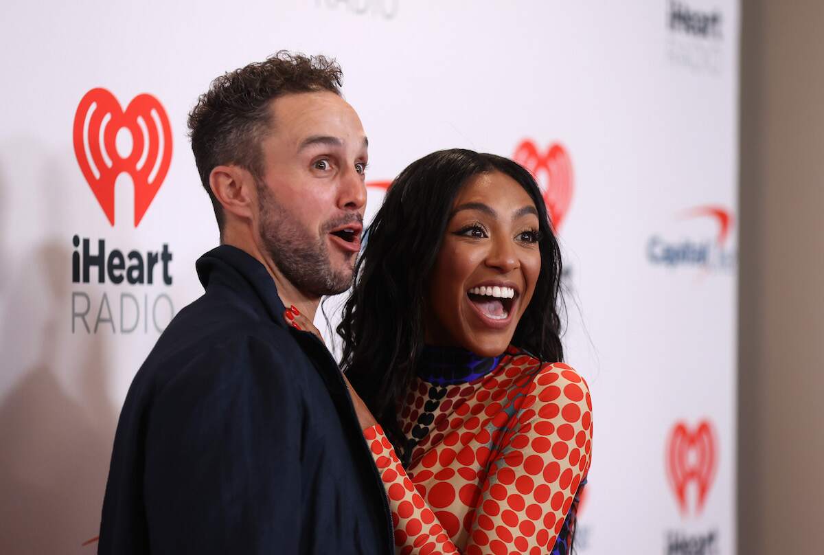 The Bachelorette stars Tayshia Adams and Zac Clark goof around for the cameras at the 2021 iHeartRadio Music Festival