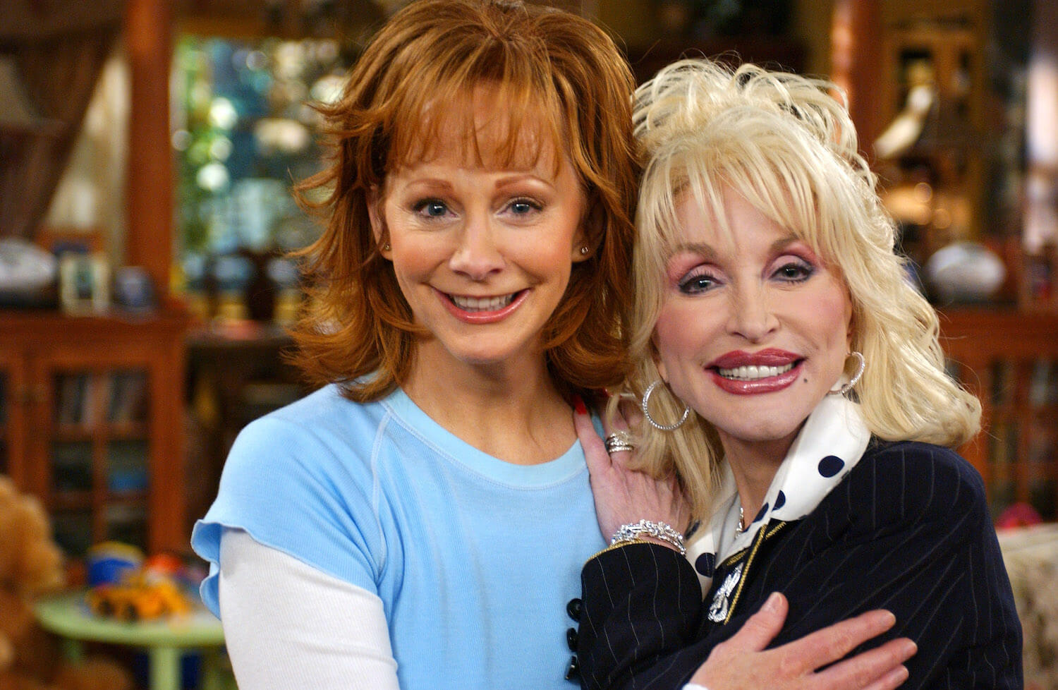 'The Voice' Season 24 star Reba McEntire smiling with Dolly Parton in 2005