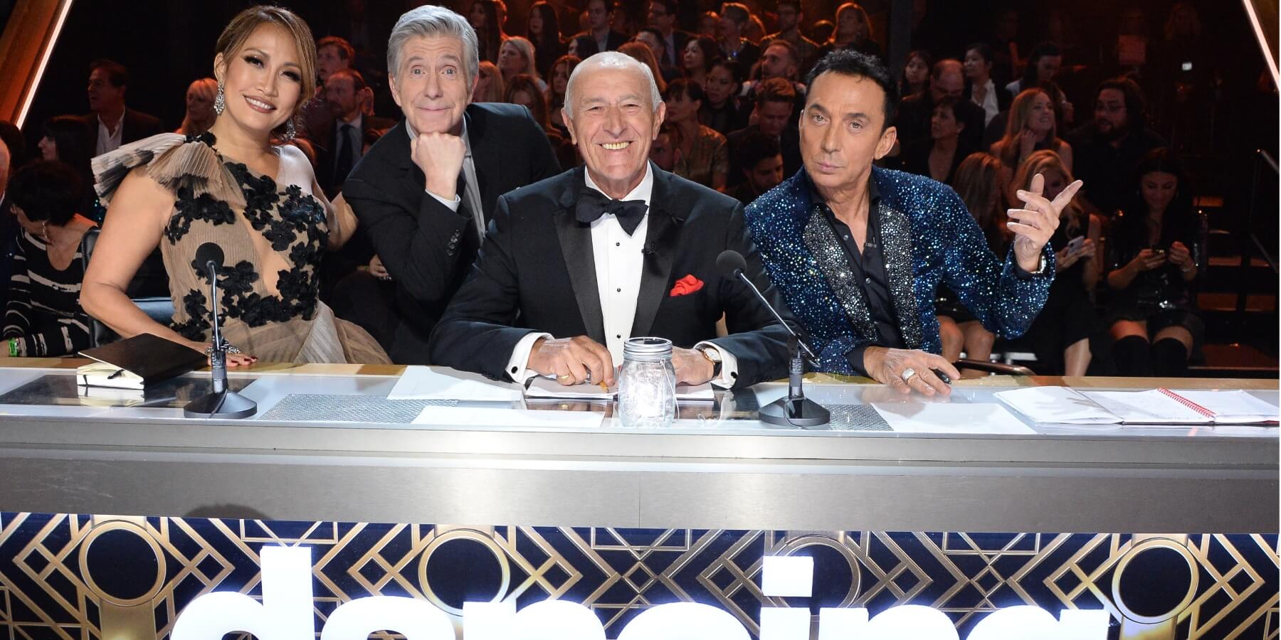 Tom Bergeron poses during season 28 of 'DWTS' alongside Carrie Ann Inaba, Len Goodman, and Bruno Tonioli.